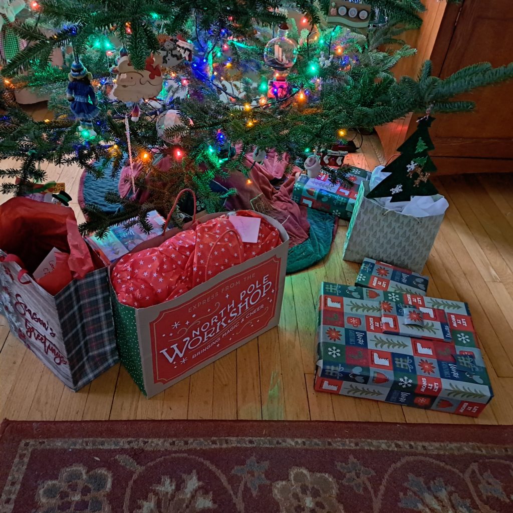 Christmas presents under tree.